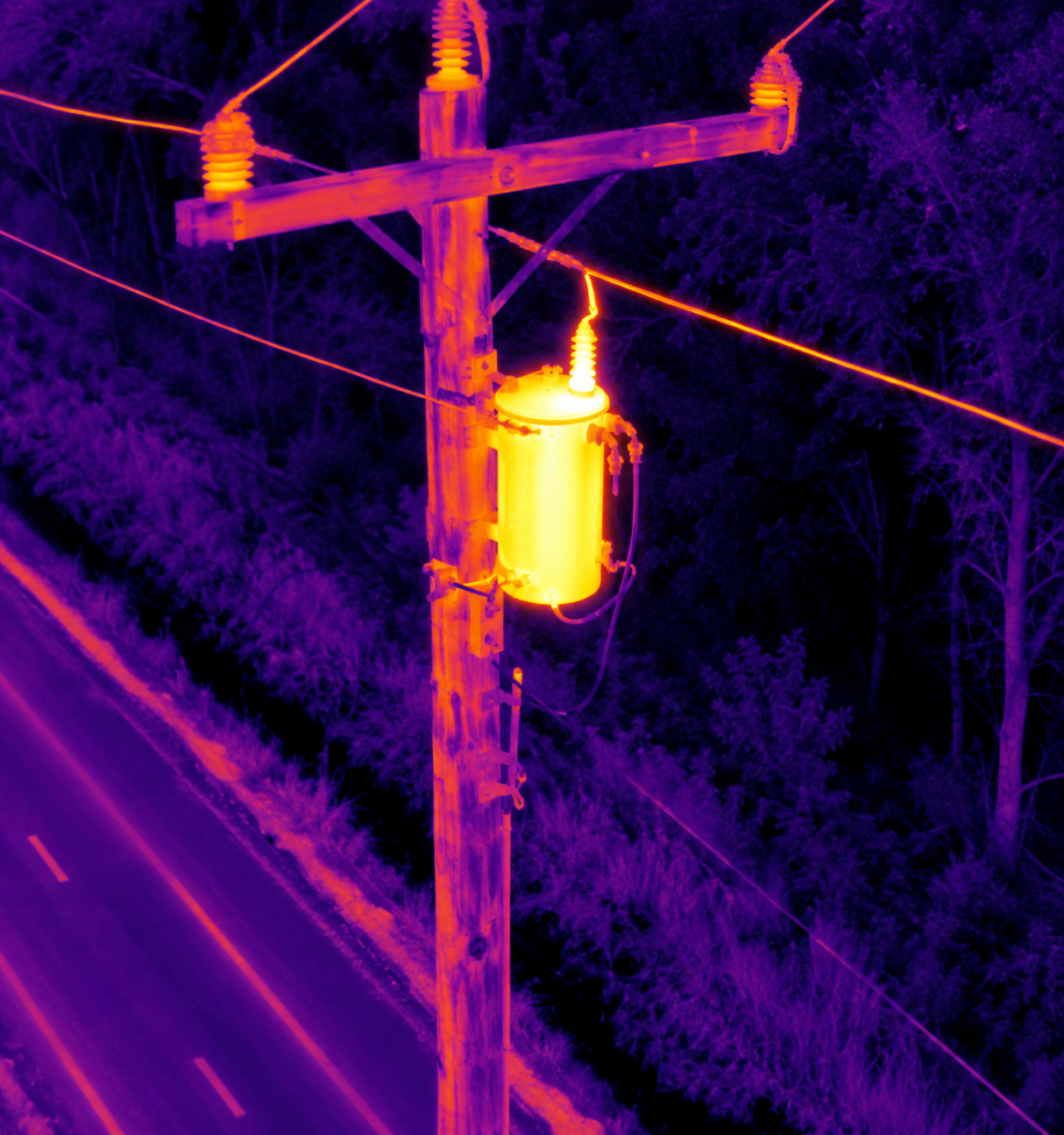 Thermal aerial image of a utility transformer and power lines